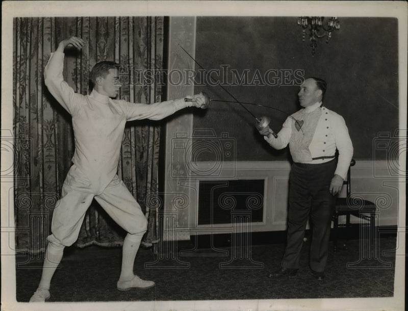 Load image into Gallery viewer, 1937 Press Photo Maurice Grasson (left), scores a touch of his father
