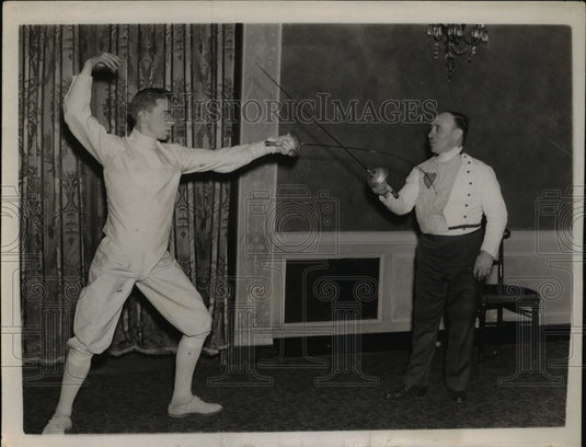 1937 Press Photo Maurice Grasson (left), scores a touch of his father