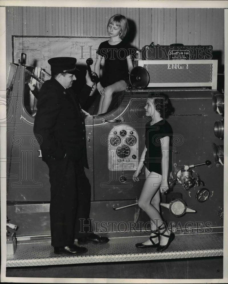 Load image into Gallery viewer, 1957 Press Photo William Mongold Junior Former Fire Chief Explaining Radio
