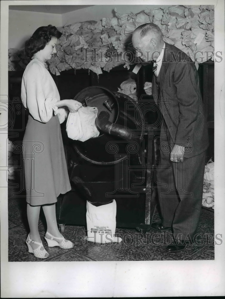 Load image into Gallery viewer, 1957 Press Photo Security First National Bank Workers Pour Coins in Cement Mixer
