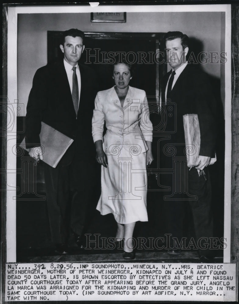 Load image into Gallery viewer, 1956 Press Photo Beatrice Weinberger Escorted By Detectives From Courthouse
