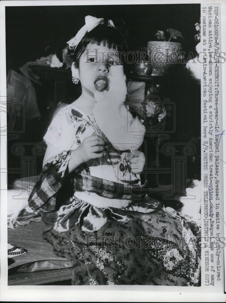 Load image into Gallery viewer, 1957 Press Photo Detroit 3 year old Raquel Salazar enjoying Cotton Candy
