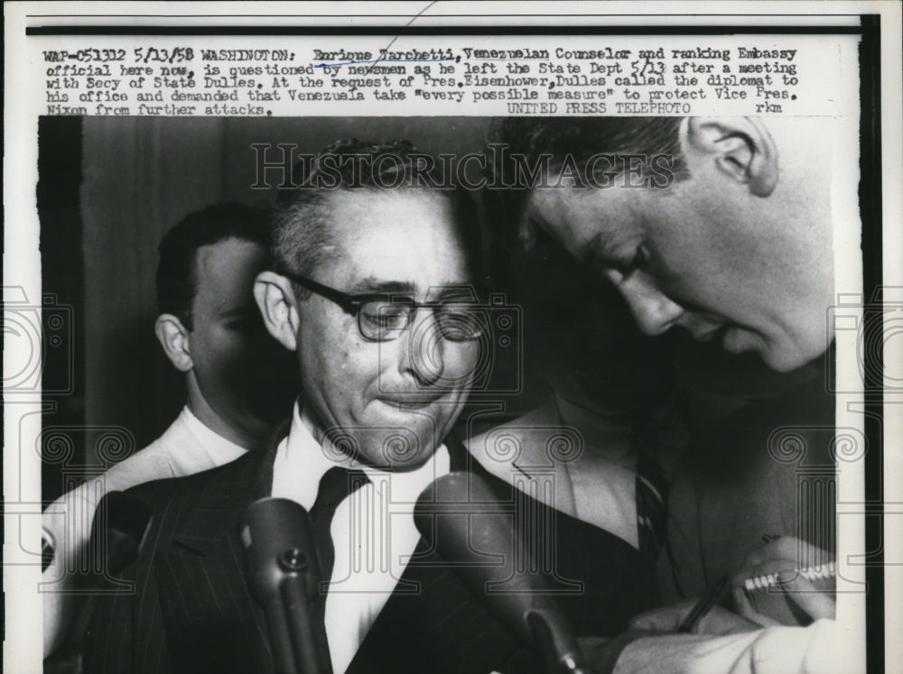 1958 Press Photo Enrique Tarchetti questioned by newsmen