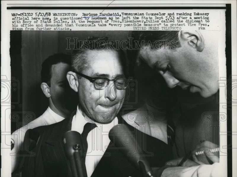 Load image into Gallery viewer, 1958 Press Photo Enrique Tarchetti questioned by newsmen
