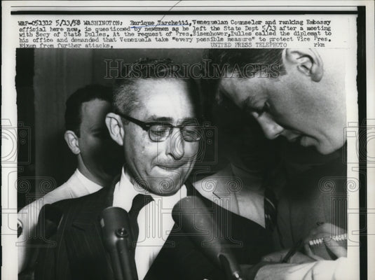 1958 Press Photo Enrique Tarchetti questioned by newsmen