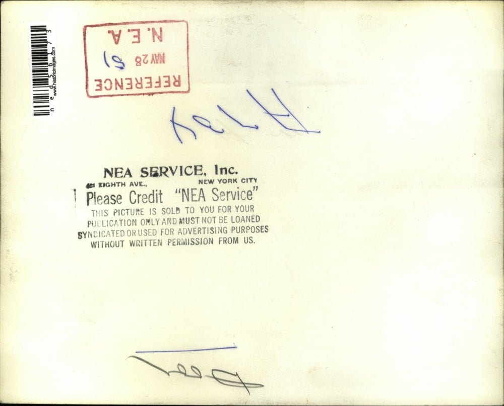 1951 Press Photo A man decorating the interior of a house