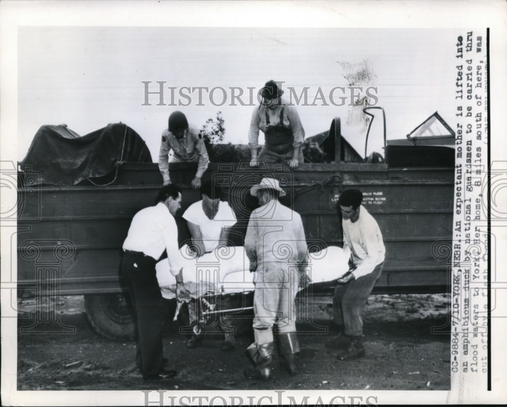 1950 Press Photo An expectant mother lifted by national guardsmen during flood
