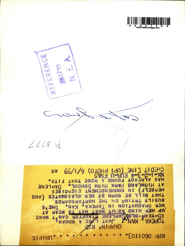 1959 Press Photo Darlene Stauffer of Topeka Tries Assortment Of Graduation Caps