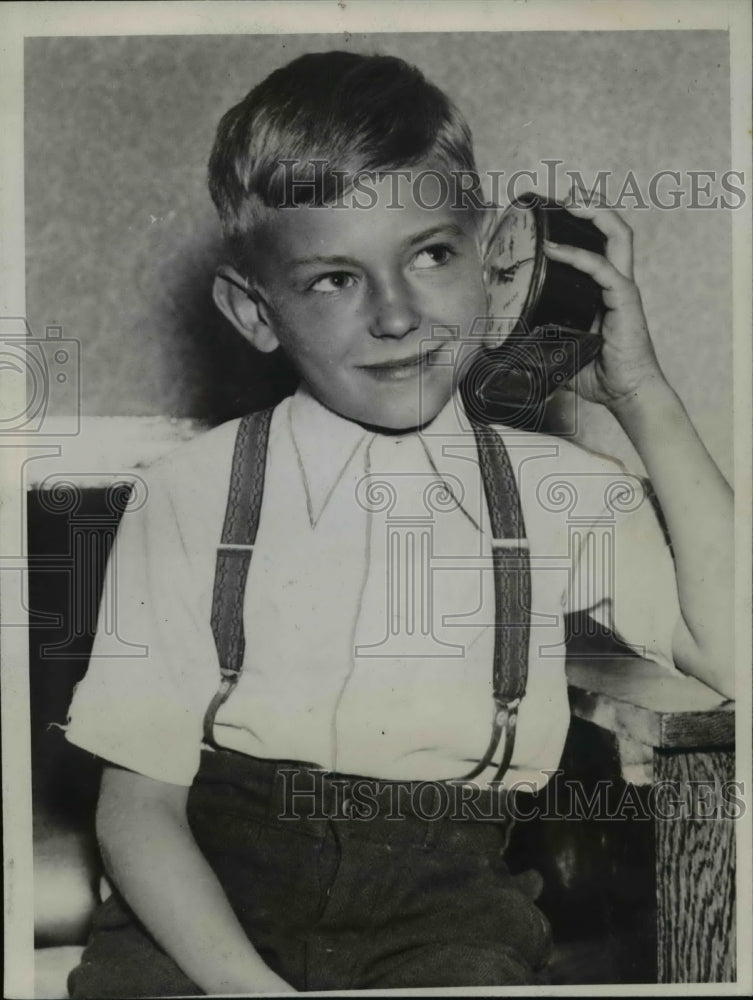 Load image into Gallery viewer, 1937 Press Photo Jack Suoka Age 8 Hears for First Time From Plane Trip
