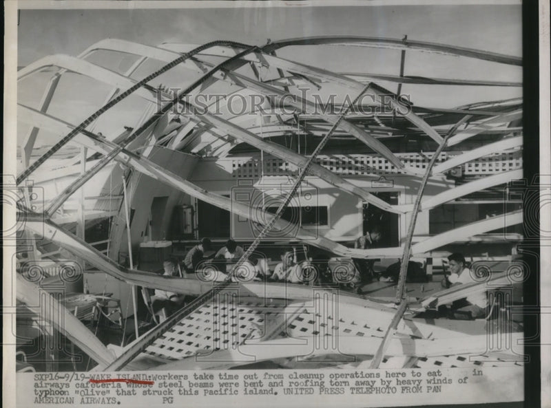 Load image into Gallery viewer, 1952 Press Photo Wake Island Typhoon Olive Cleanup Workers Under Collapsed Bldg
