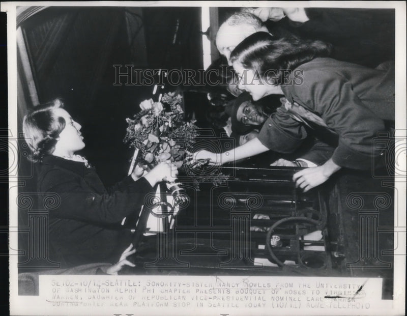 Load image into Gallery viewer, 1948 Press Photo Aplhi Phi Chapter Nancy Rowles gives bouquet to Virginia Warren
