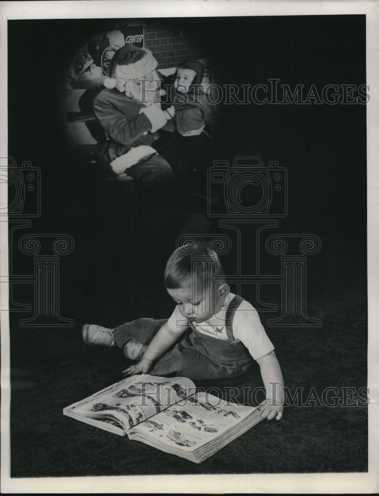 1949 Press Photo Little Russell De Vilbiss wanders what will Santa give him