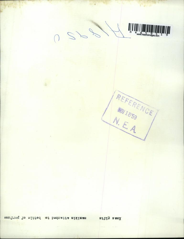 1959 Press Photo A Christmas gift idea, mannequin attached to a perfume bottle