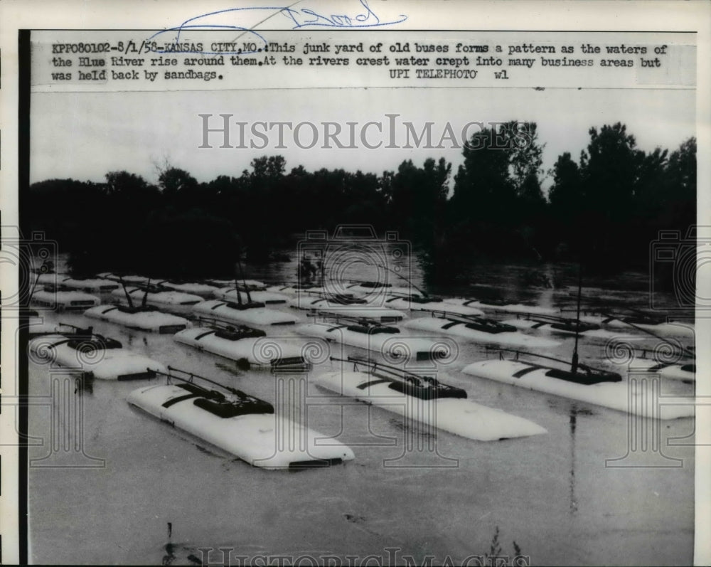 1958 Press Photo Junkyard of old buses submerged in flood
