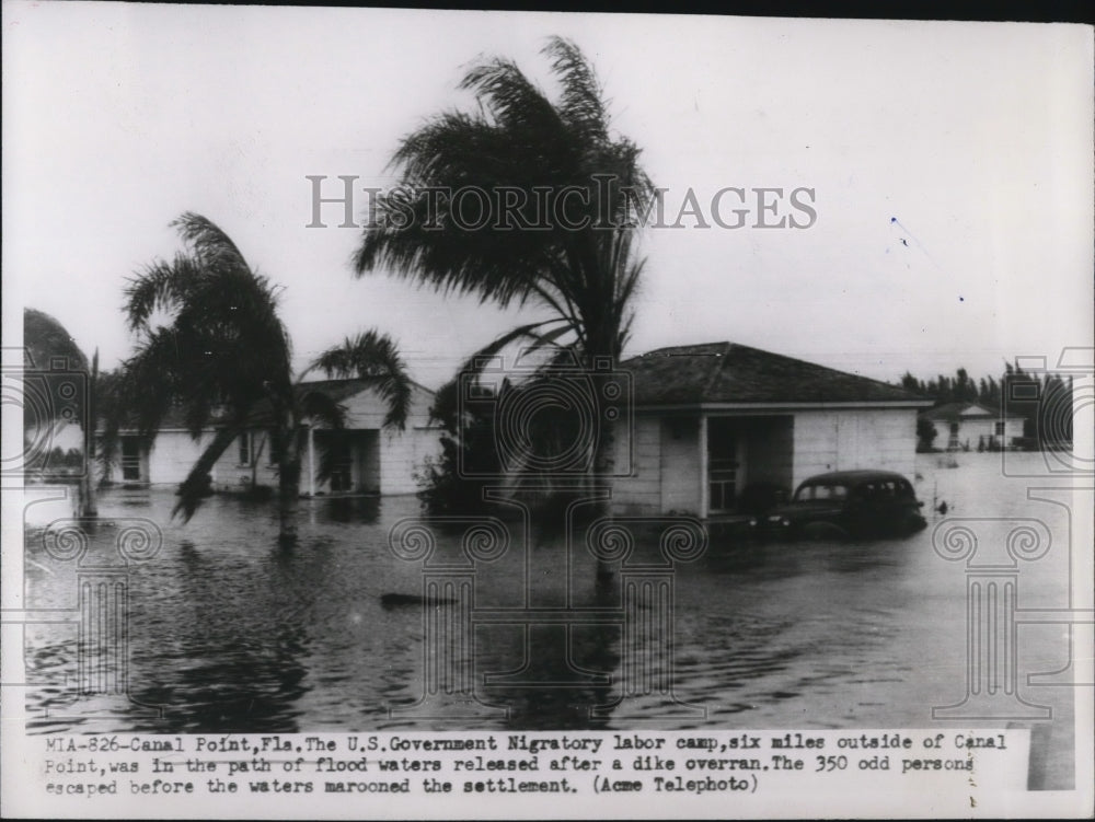 1947 Press Photo Flood waters at U.S. Government NIgratory labor Camp.