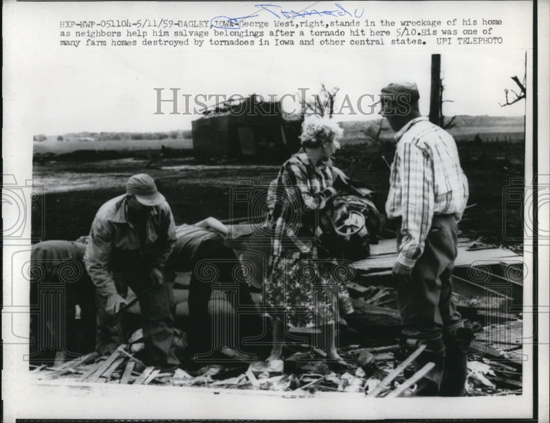 Load image into Gallery viewer, 1959 Press Photo George West (R) stands in the wreckage of his home
