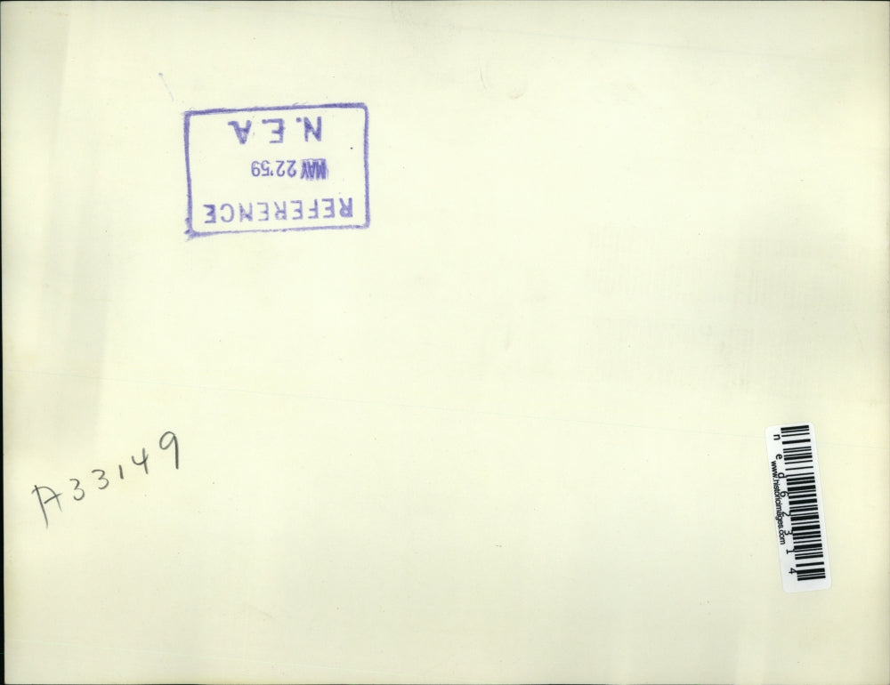 1959 Press Photo George West (R) stands in the wreckage of his home