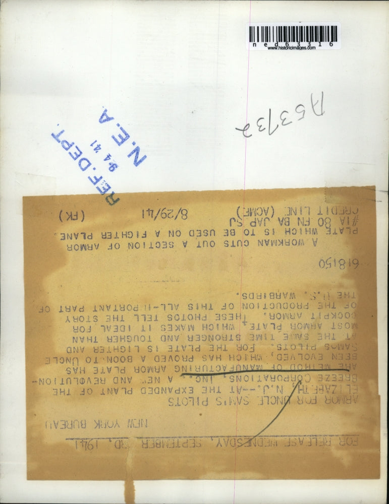 1941 Press Photo Workman cuts armor plate at plant of Breeze Corporations Inc