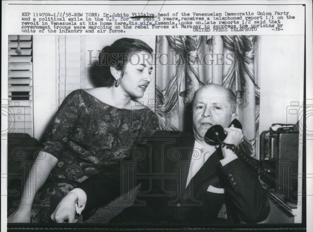 1958 Press Photo Dr. Jobito Villalva & wife, Ismenia, receive phone call