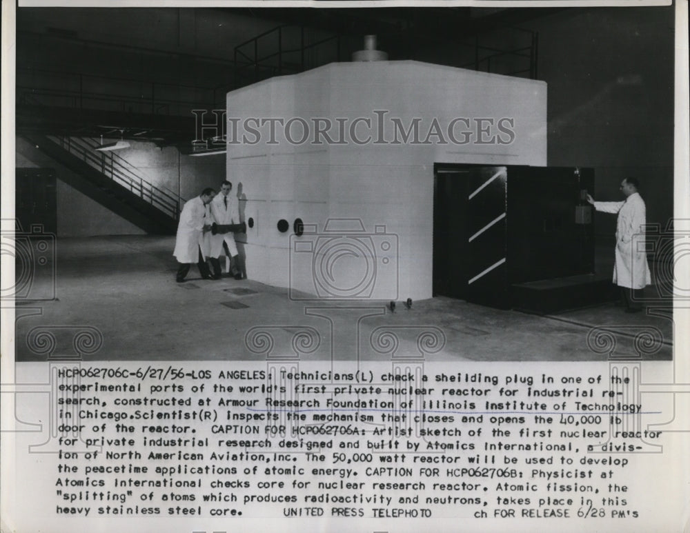 1956 Press Photo Los Angeles technicians check a shielding plug in one of the