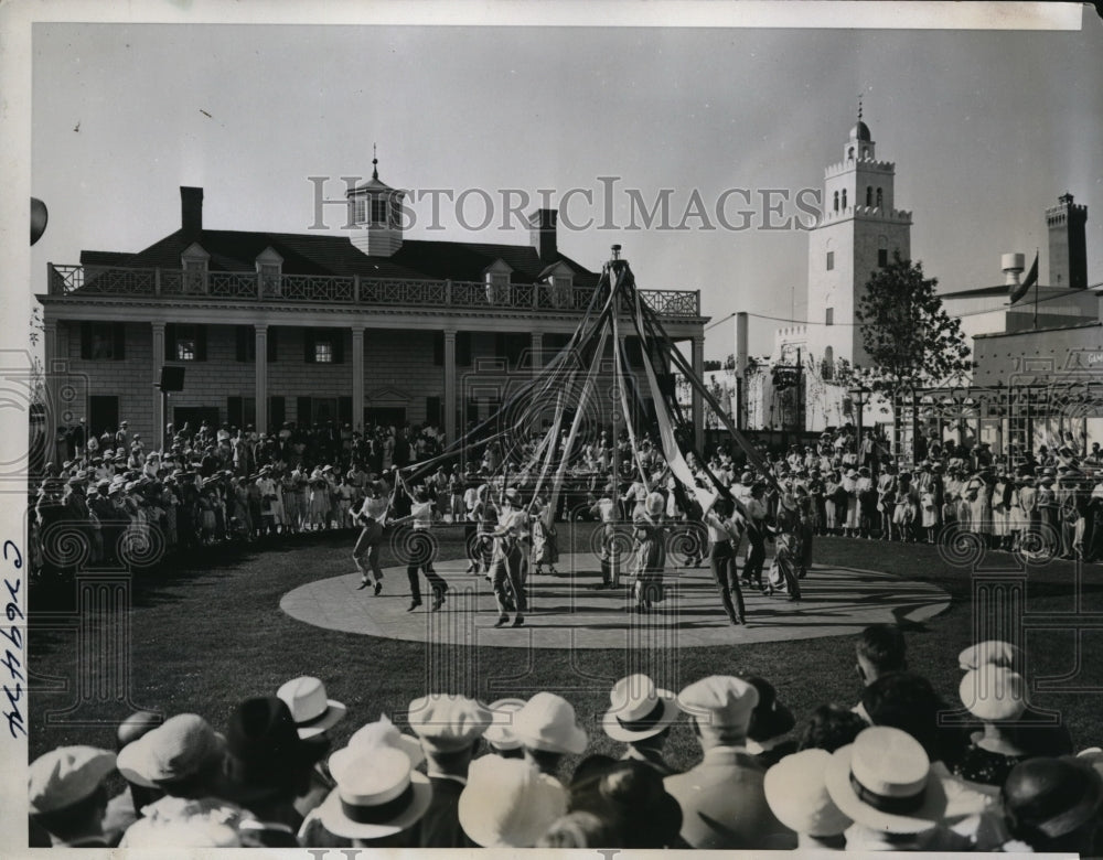 1934 Press Photo Dancing around the may pole on the lawn of the replica
