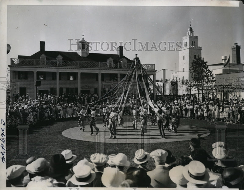 Load image into Gallery viewer, 1934 Press Photo Dancing around the may pole on the lawn of the replica

