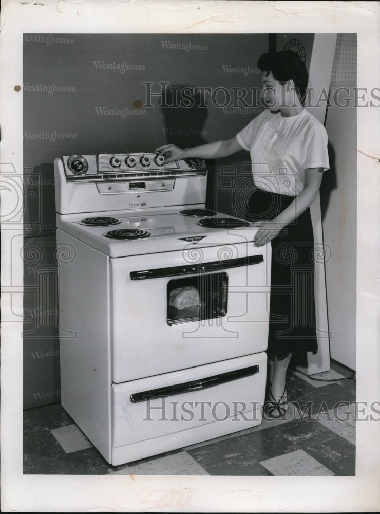 Load image into Gallery viewer, 1957 Press Photo New Westinghouse 30 inch electric range Mrs Phyllis Mottess
