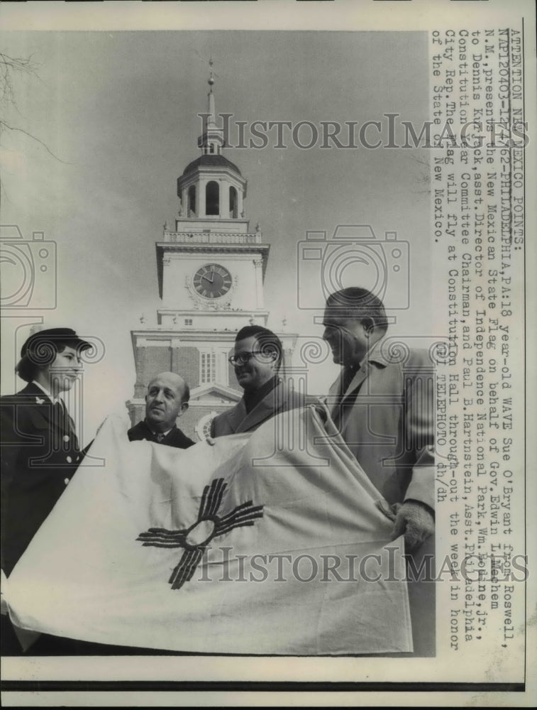 Load image into Gallery viewer, 1962 Press Photo Sue O'Bryant, 18, presents the New Mexican State Flag
