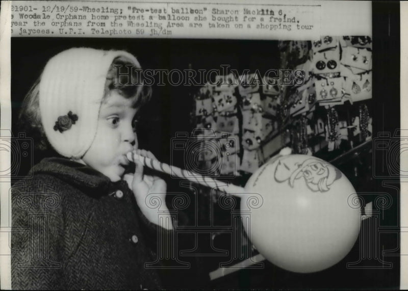 Load image into Gallery viewer, 1959 Press Photo Wheeling Sharon Macklin of Woodale Orphans home pretests a
