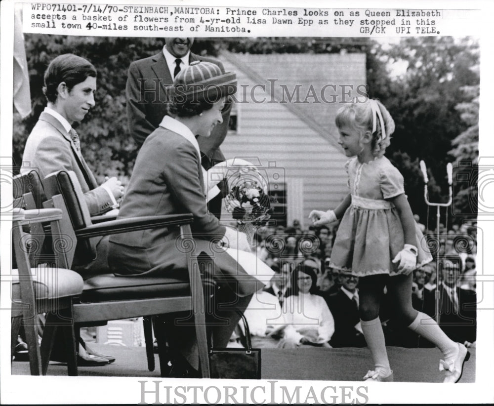 1970 Press Photo Prince Charles looks on Queen Elizabeth accepts flower basket- Historic Images