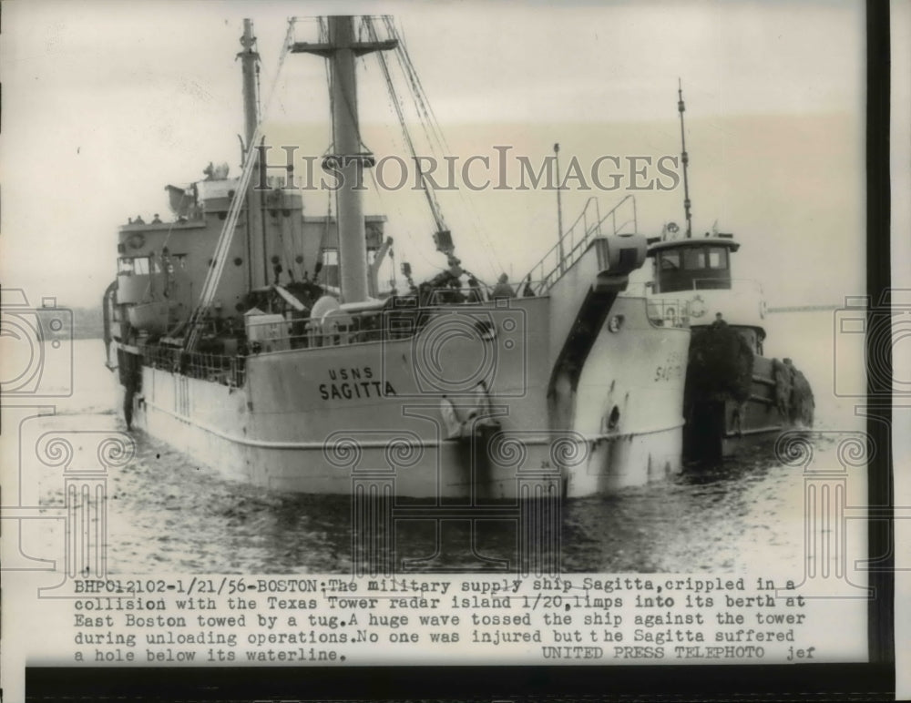 1956 Press Photo Military supply ship Sagitta gets a tow with a tugboat.