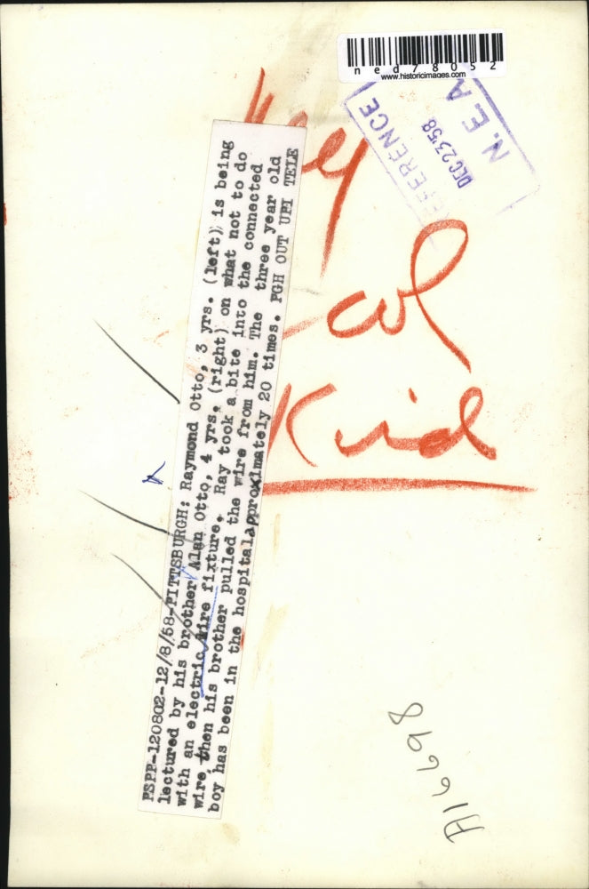 1957 Press Photo Raymond Otto with Brother Alan after Biting into Wire