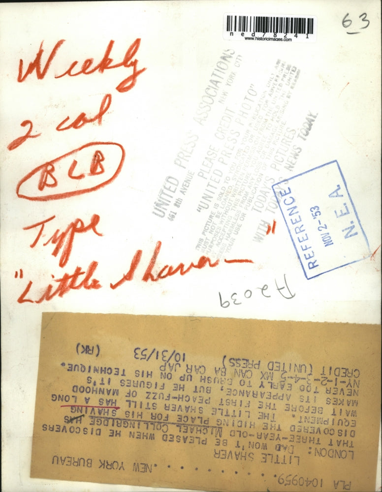 1953 Press Photo Michael Collingridge uses his father shaving equipment.