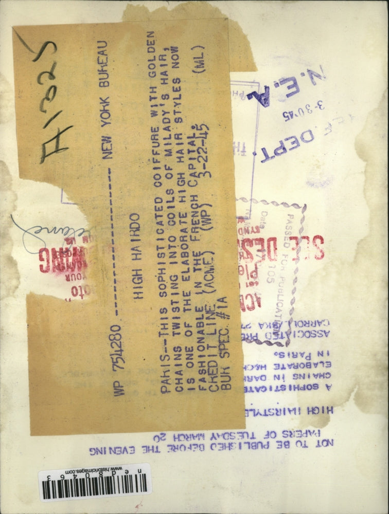 1945 Press Photo Sophisticated Coiffure w/ Golden Chains twisting into coils