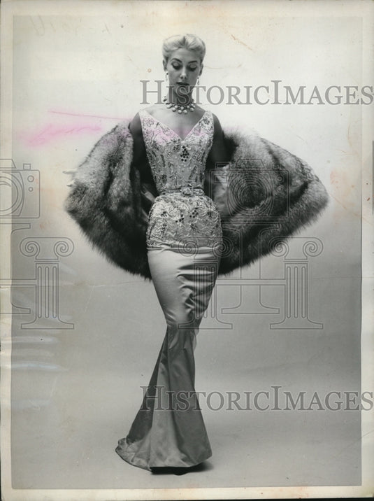 1953 Press Photo Pale Blue Rhinestones encrust the fitted bodice of satin gown