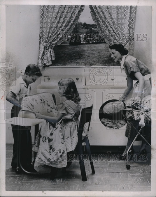 1953 Press Photo modern appliances like the ironer are safe for children.