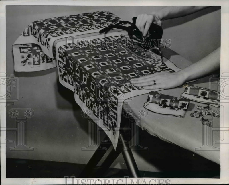 Load image into Gallery viewer, 1953 Press Photo Homemaker using a iron to press hankies
