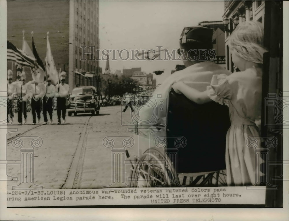 1953 Press Photo War-wounded veteran sees colors pass at American legion parade