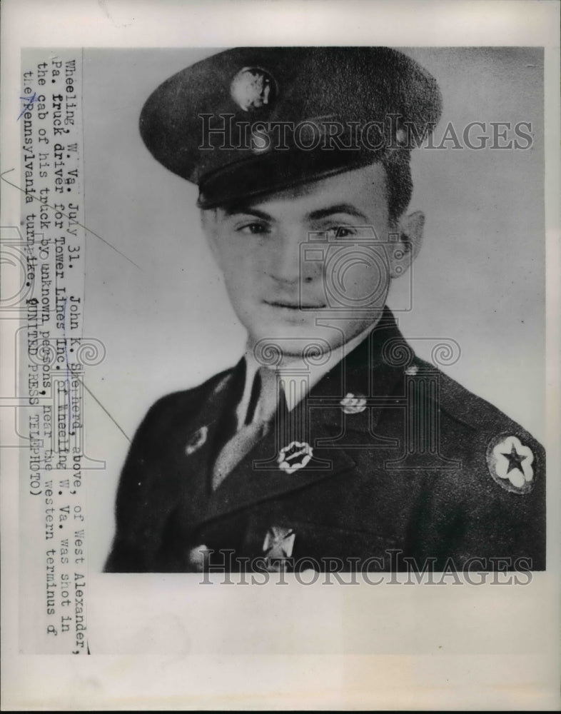 1953 Press Photo John K.Shepherd Truck Driver for Tower Lines Inc. shot in cab.