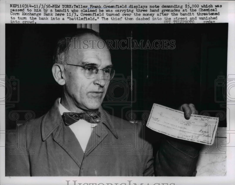 Load image into Gallery viewer, 1958 Press Photo Bank teller, Frank Greenfield displays the note from a bandit
