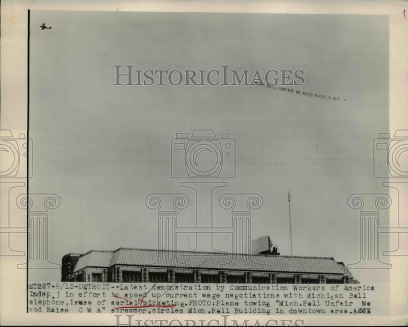 Load image into Gallery viewer, 1948 Press Photo Plane tow Michigan Bell Unfair We Need Raise CWA streamer
