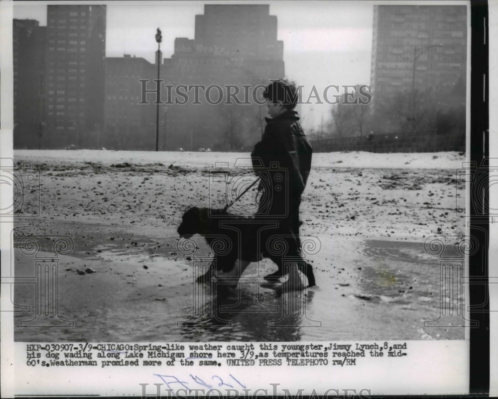 1955 Press Photo Jimmy Lynch and Dog Wading Along Lake Michigan Shore in Chicago