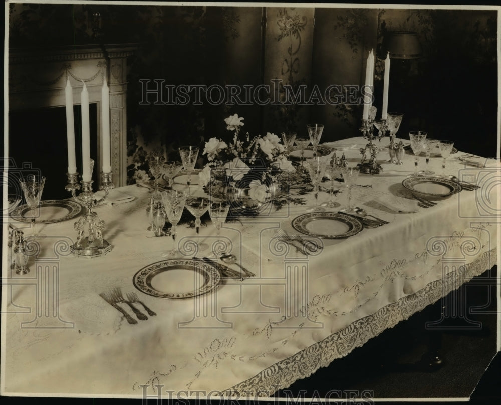 1932 Press Photo Embroidered Linen Tablecloth Silver Gilt Candlesticks & China