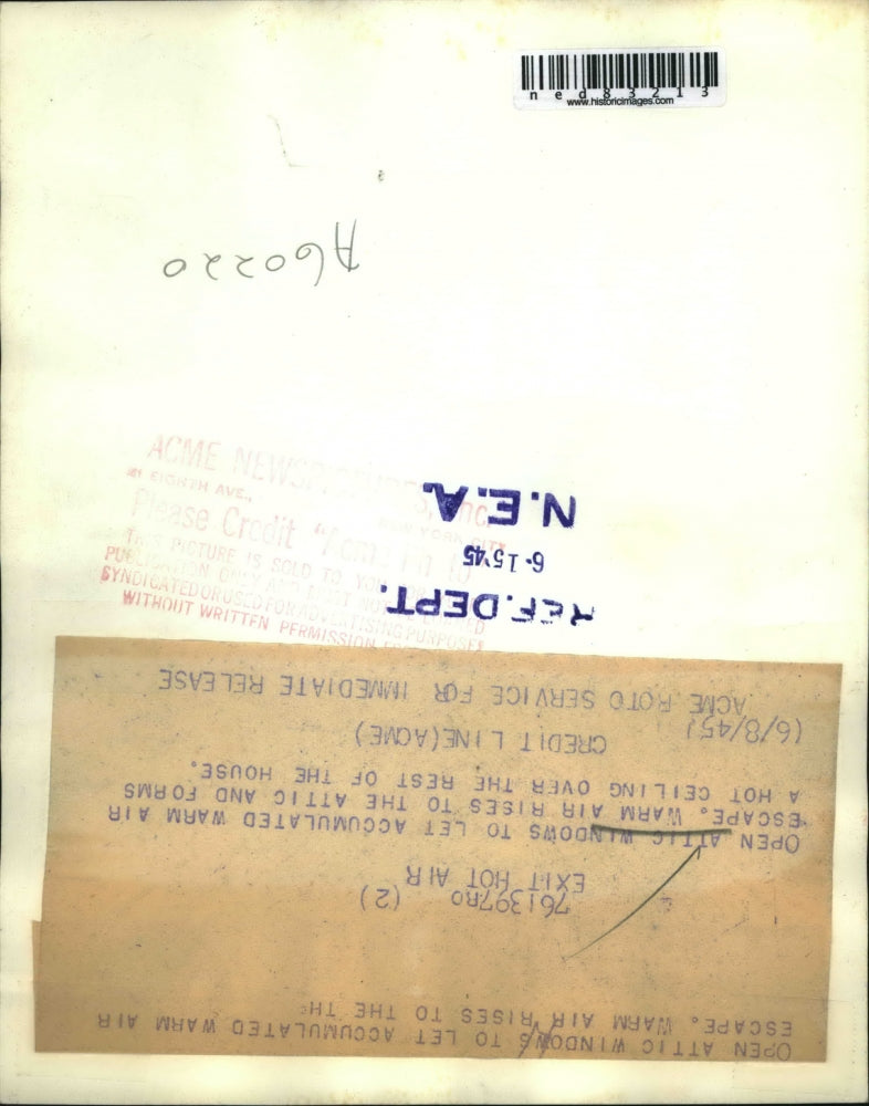 1945 Press Photo Woman Opening Attic Windows for Ventilation