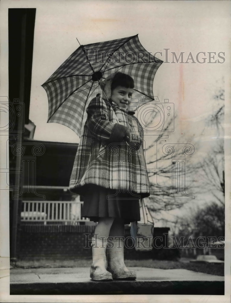 Load image into Gallery viewer, 1961 Press Photo Mary Jo Sweet waiting for her schoold bus.
