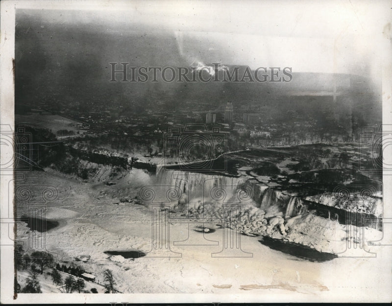 Load image into Gallery viewer, 1938 Press Photo Air view of the American and Canadian Niagara Falls on winter

