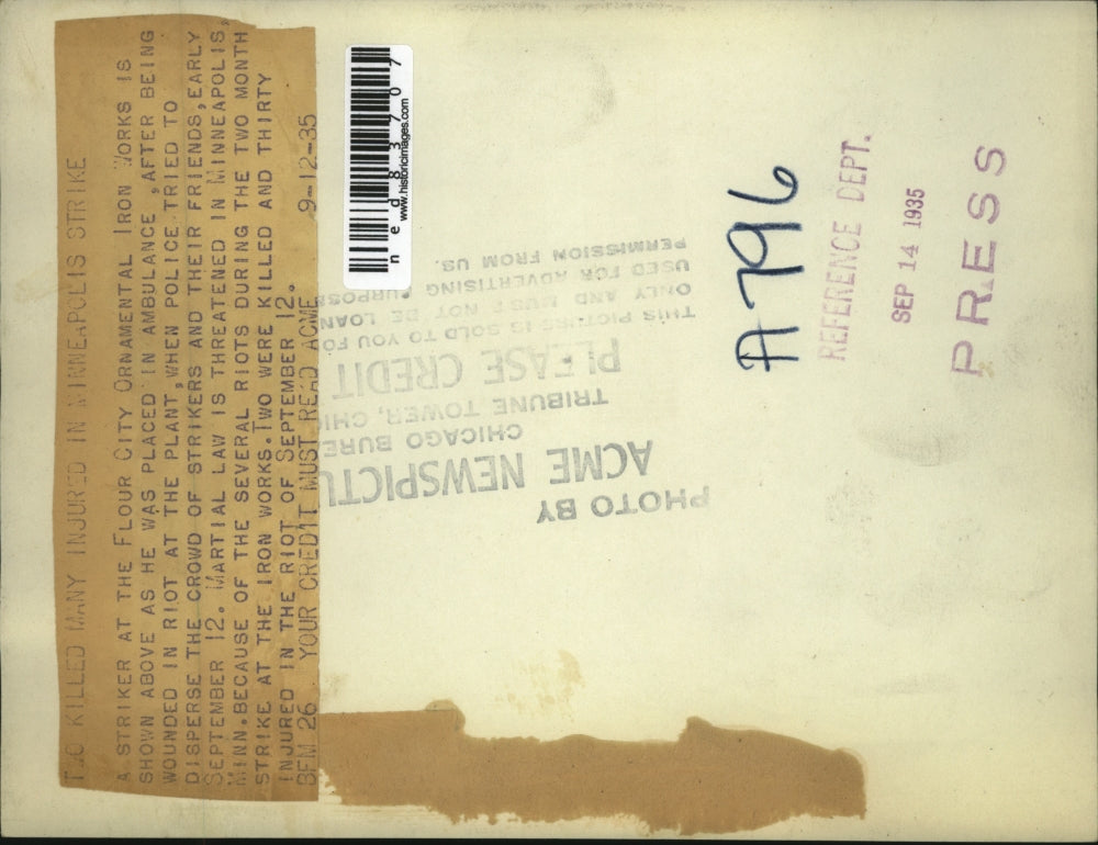 1935 Press Photo An Iron Works striker was placed in an ambulance after the riot