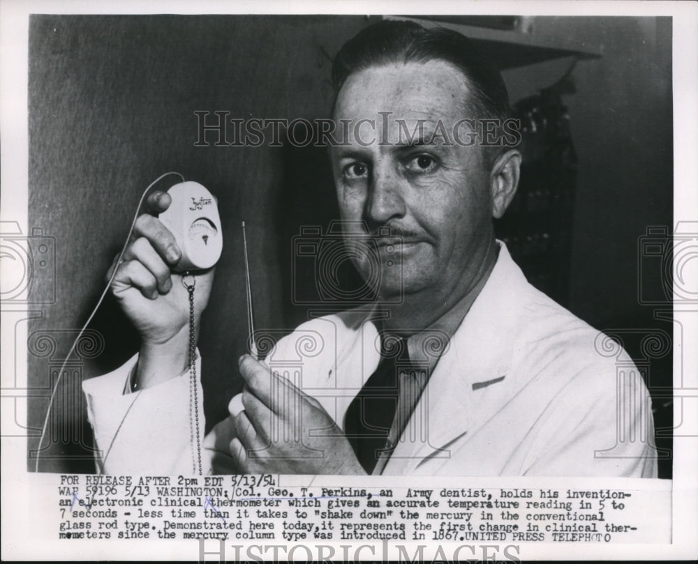 1954 Press Photo Geo Perkins Holding his Electronic Clinical Thermometer