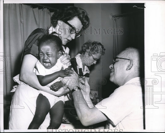 1956 Press Photo Kathleen Bunton gets polio vaccine from Doctor BJ Neiman