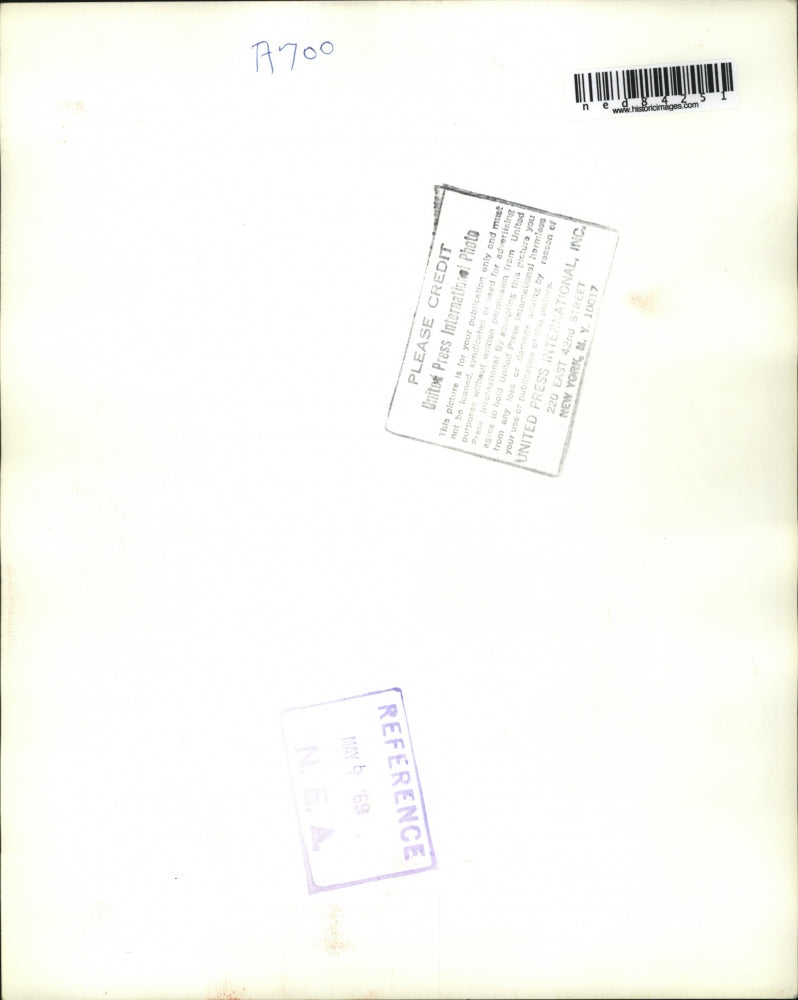 1969 Press Photo Crowd watches as youths place flowers and photo Thomas G.